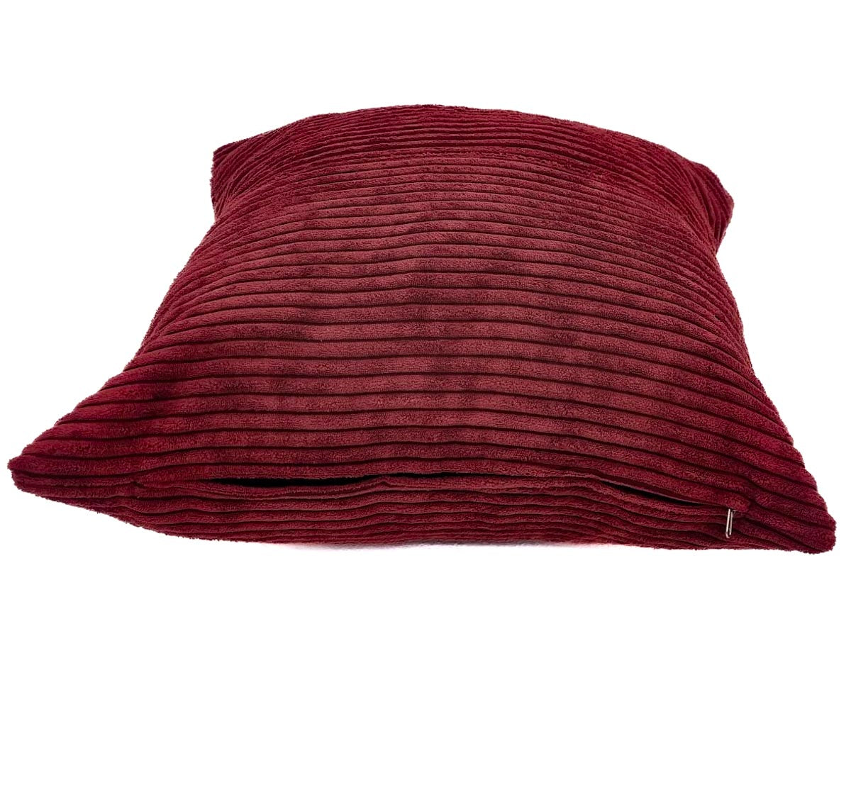 Red textured pillow on a white background