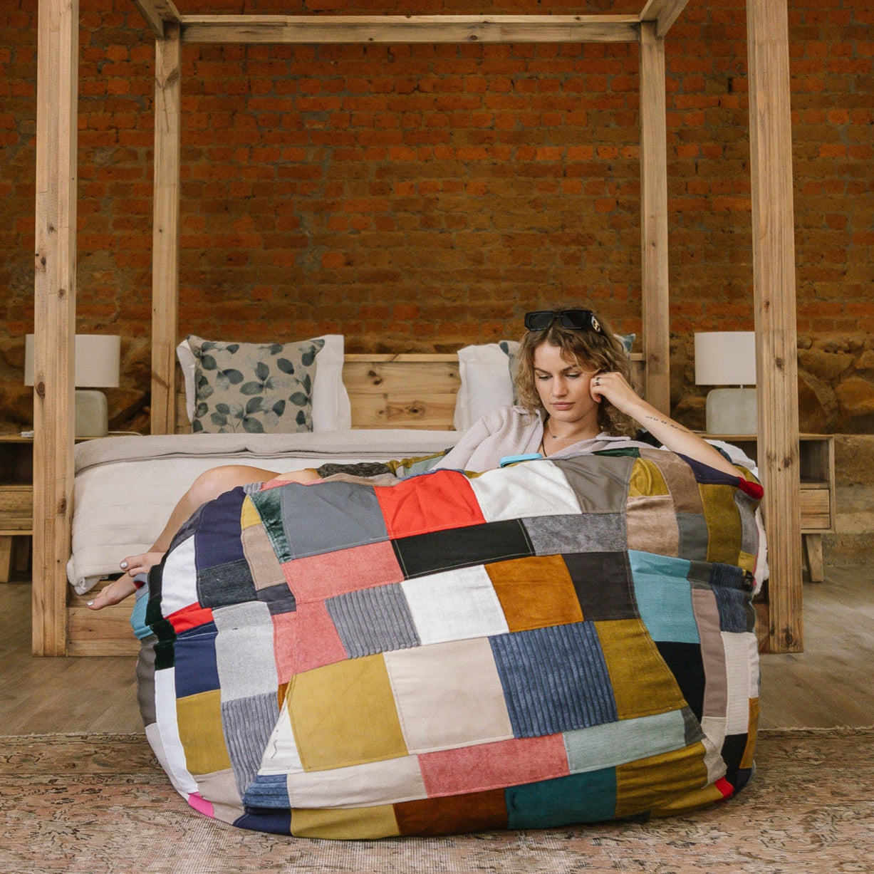 Woman sitting on patchwork beanbag
