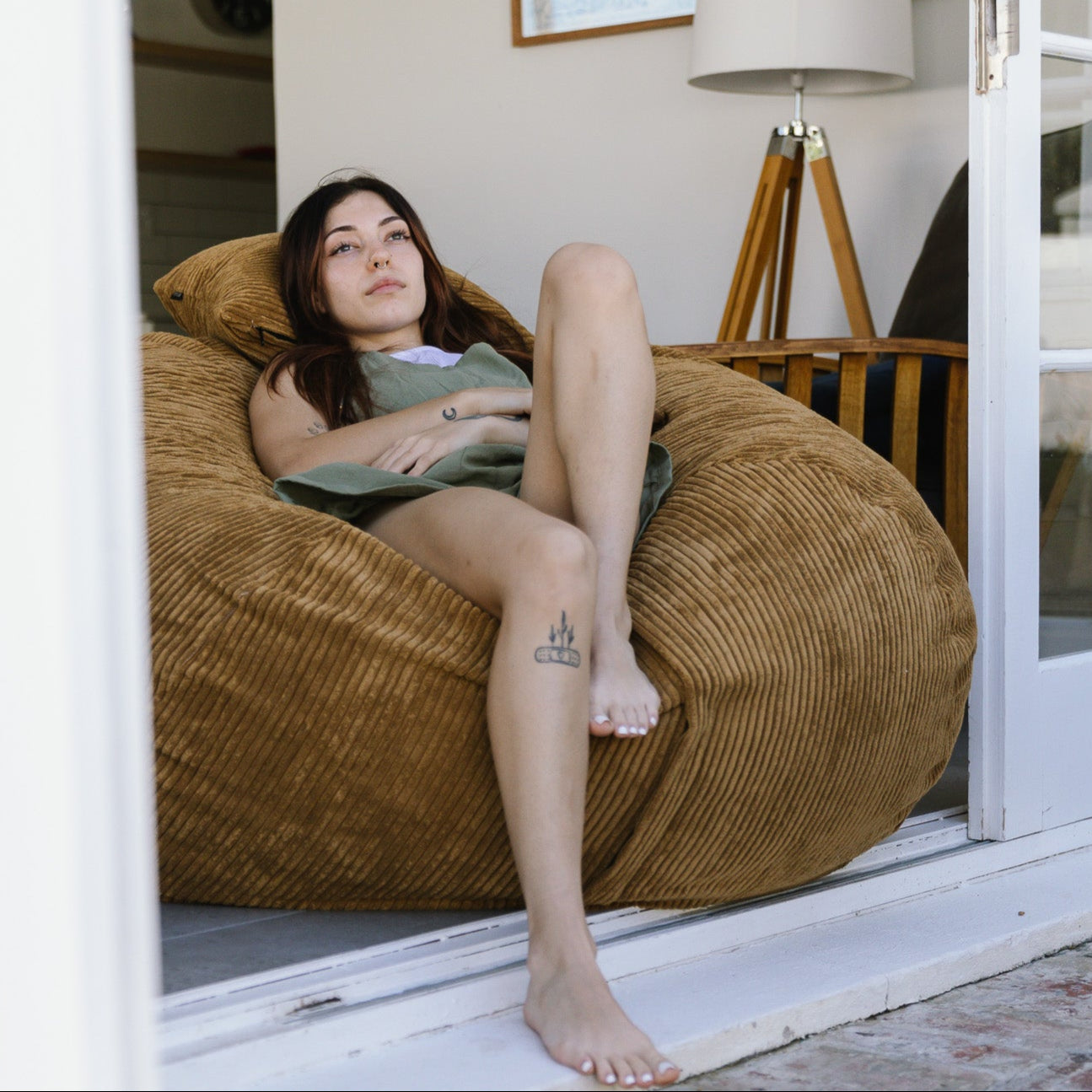 Woman sitting on brown beanbag in Stellenbosch