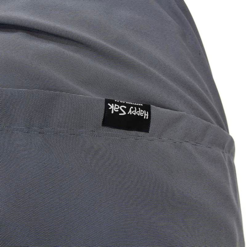 Close-up of a gray fabric cover with a brand label reading 'Happy Sak'.