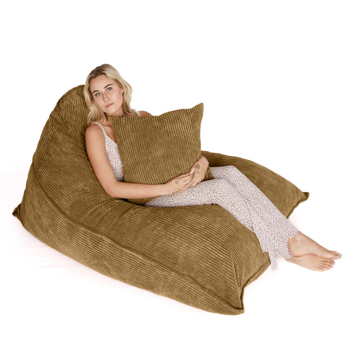 Woman sitting on light brown corduroy FlipSak beanbag