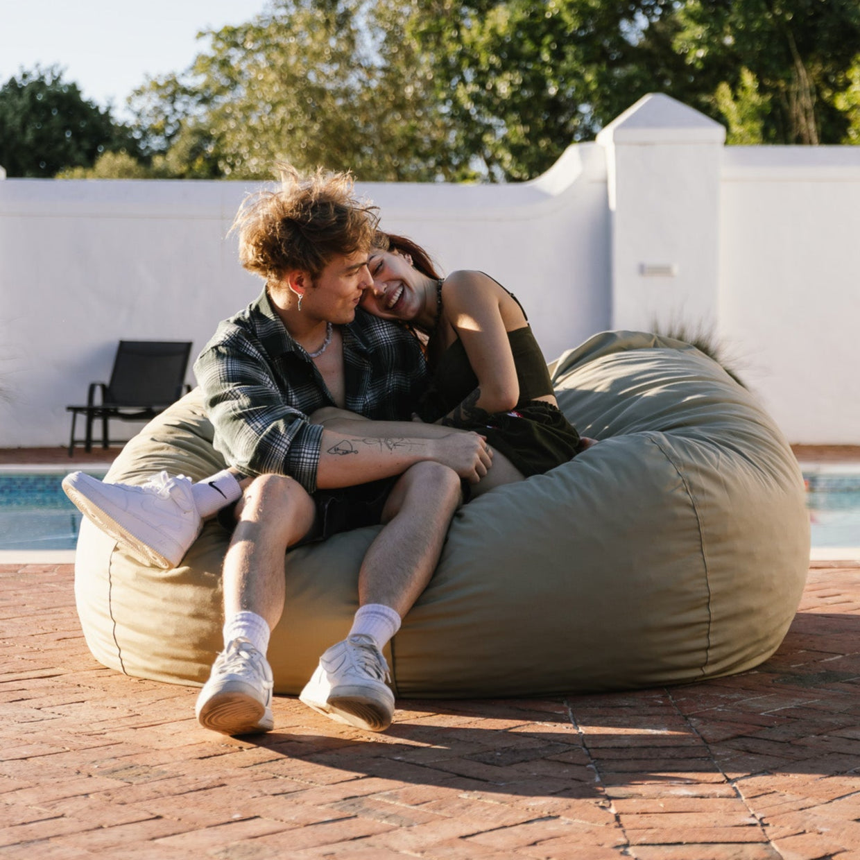 Couple sitting on an XL Khaki Outdoor Bean Bag