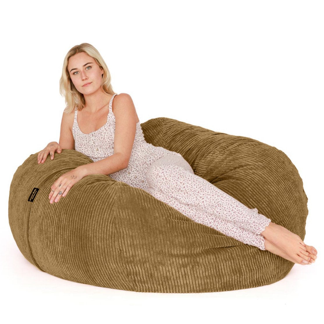 woman lying on brown beanbag