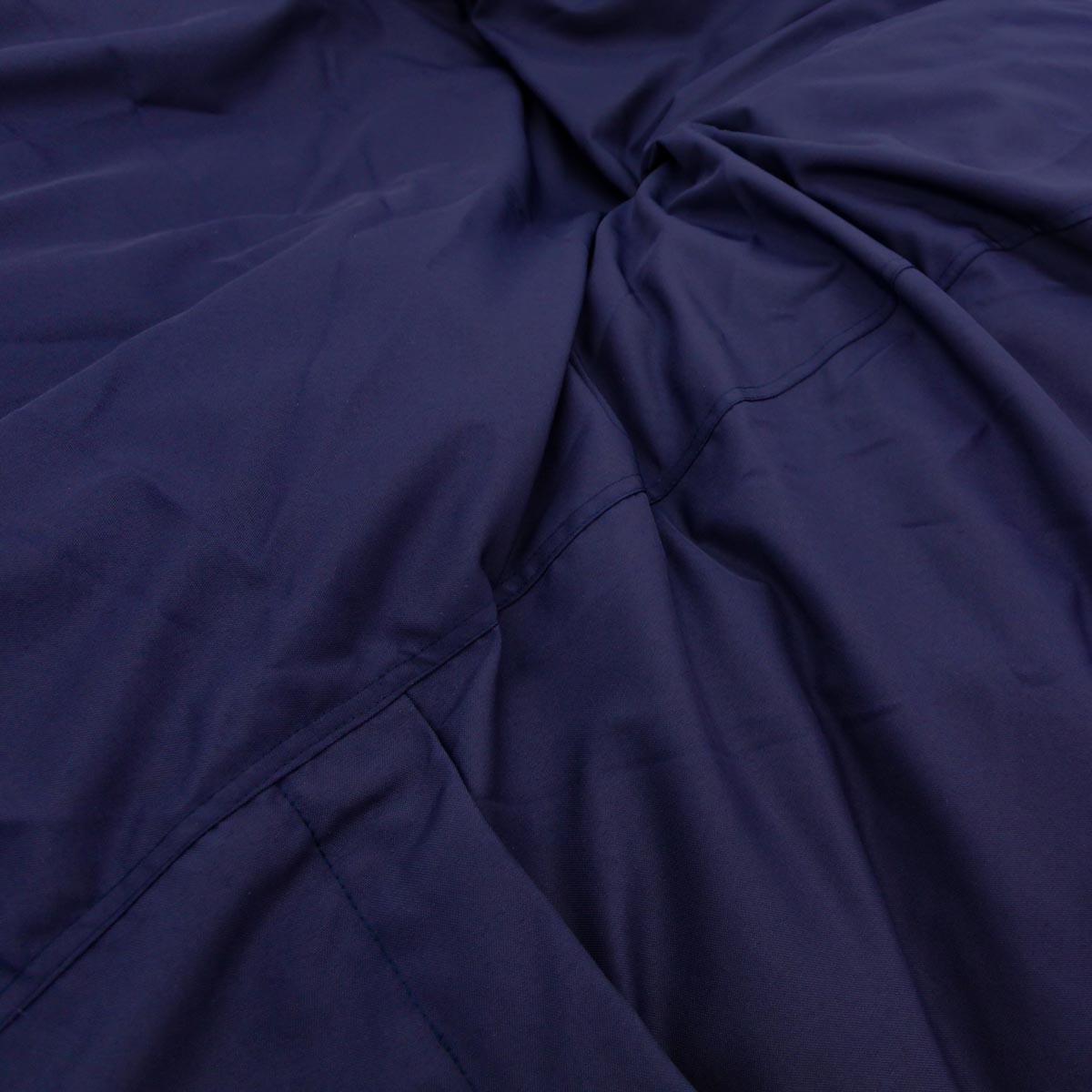 Close-up of dark blue fabric with folds