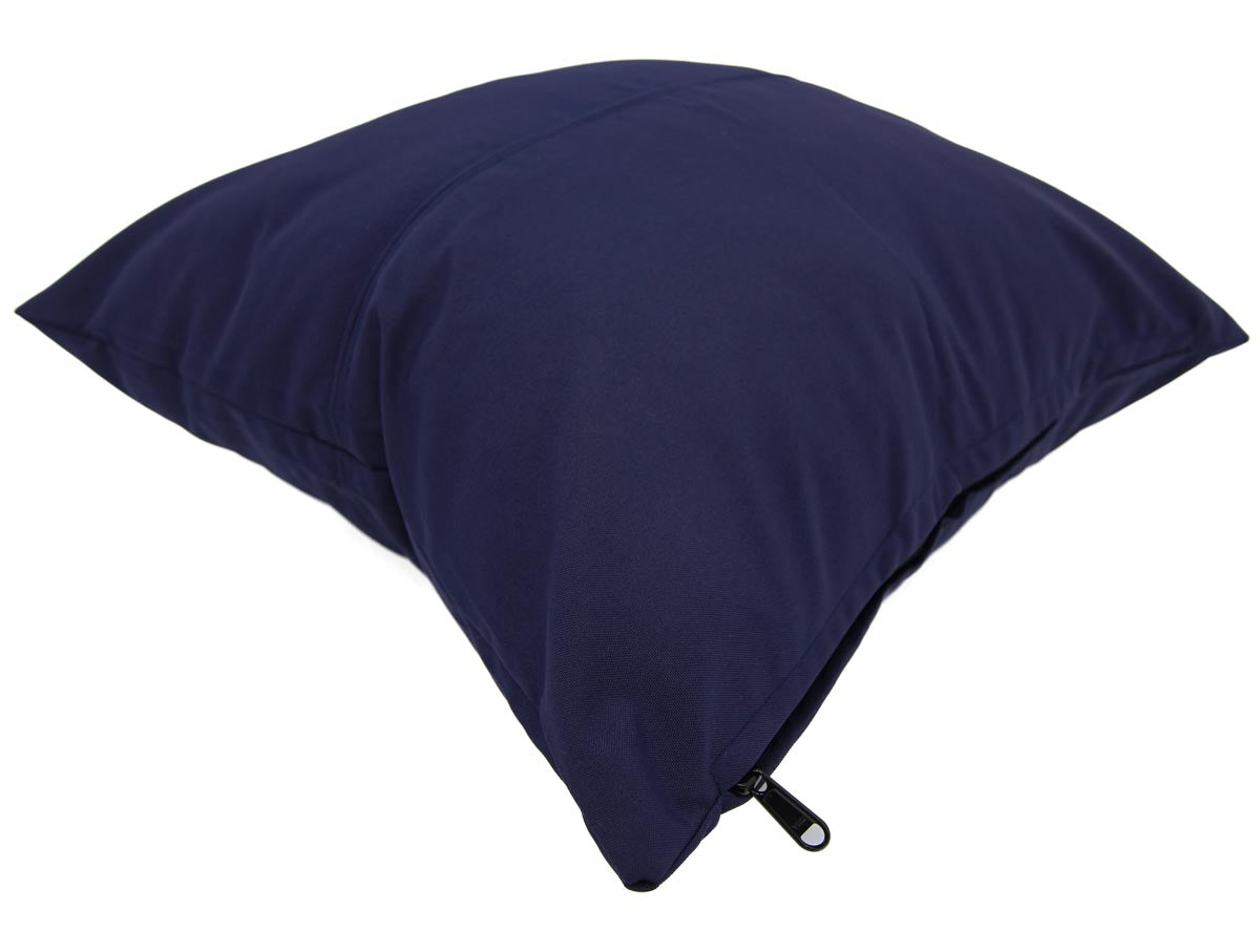 Navy blue pillow with a zipper on a white background