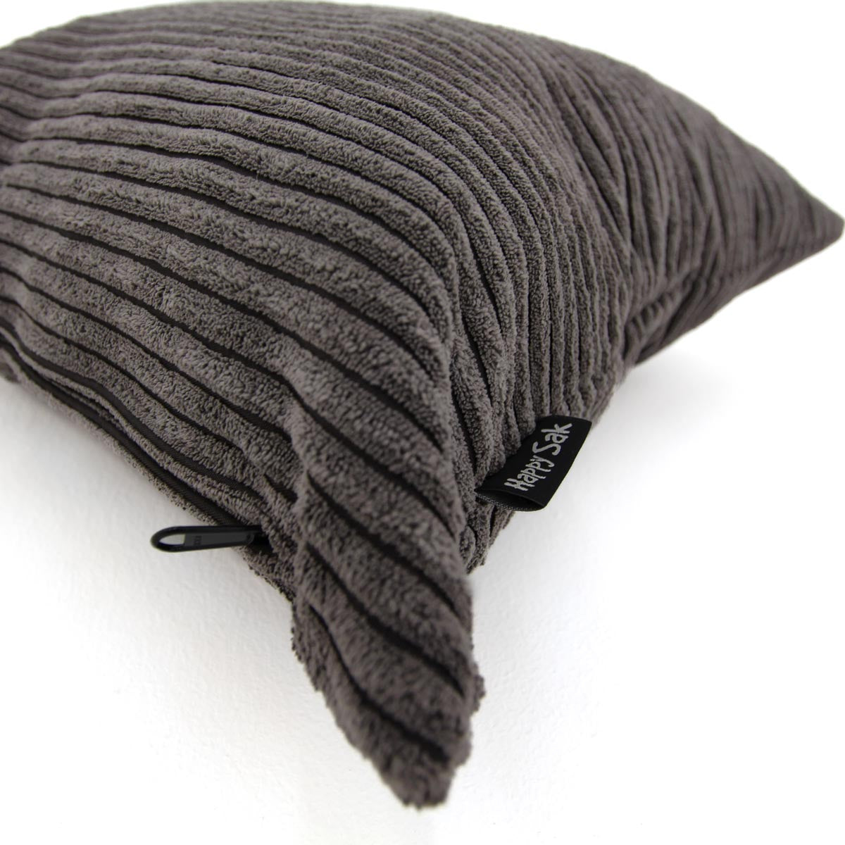 Gray textured pillow with a brand label on a white background