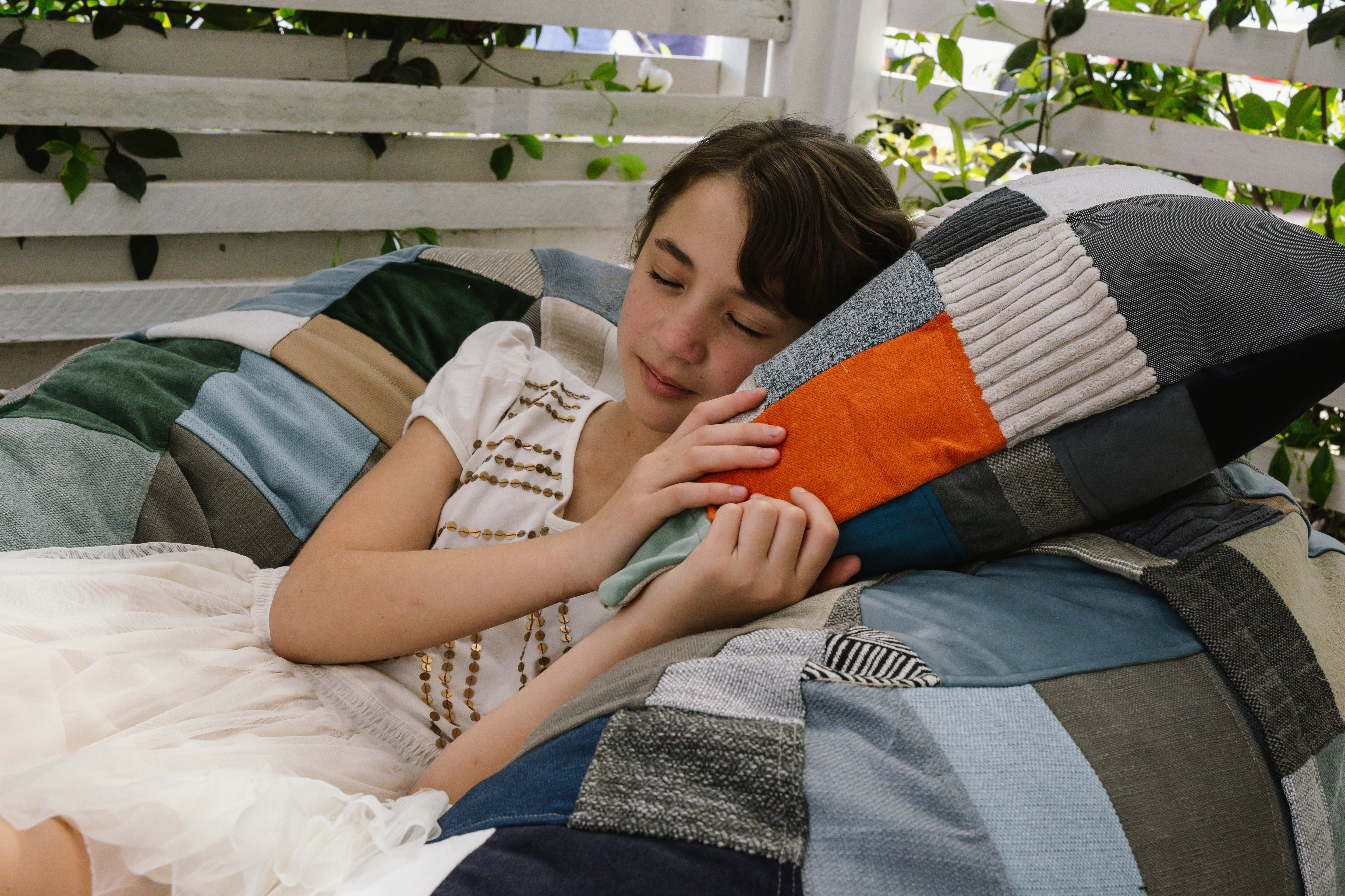 Girl sleeping on xs patchwork beanbag