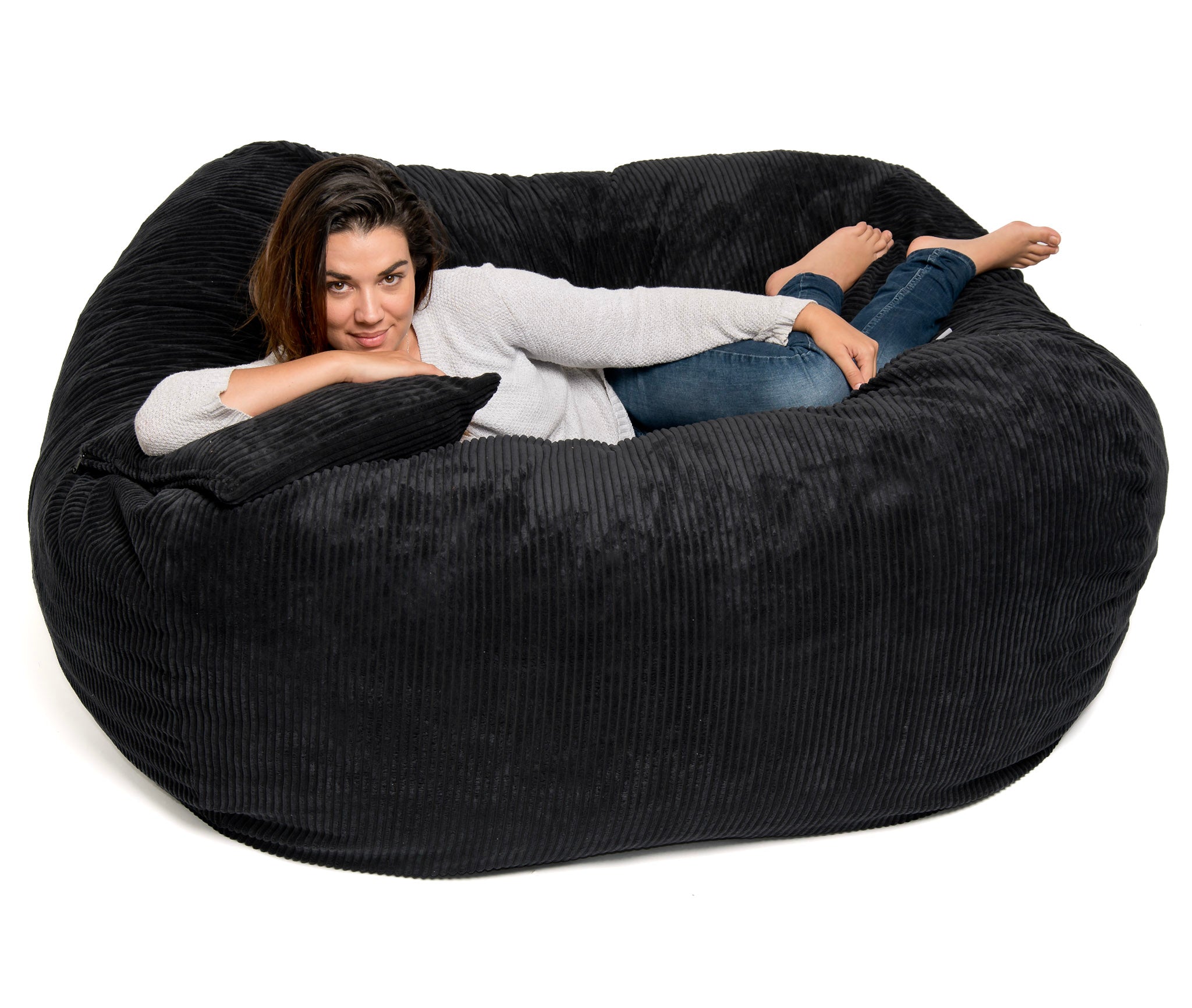 Girl reclining on black cord bean bag