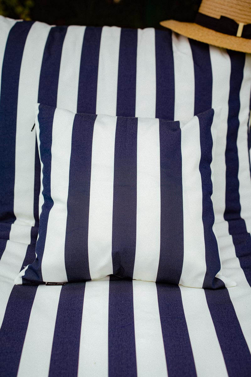 Navy and white striped cushion on a chair