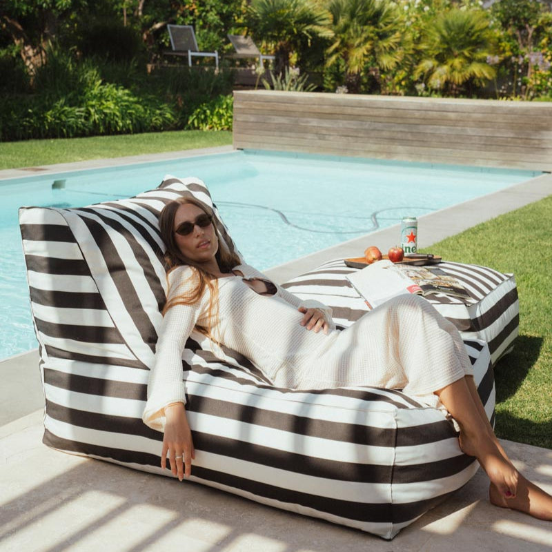 woman on a black and white stripe bean bag