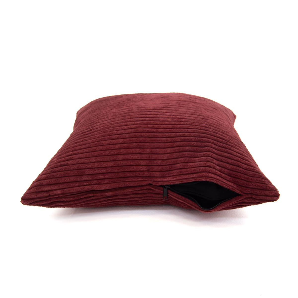 Maroon ribbed pillow on a white background