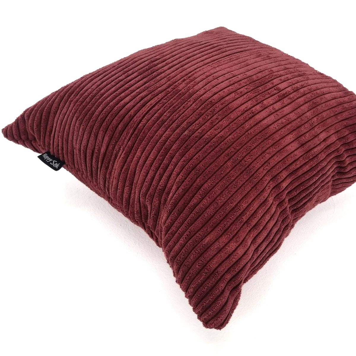 Maroon ribbed pillow on a white background