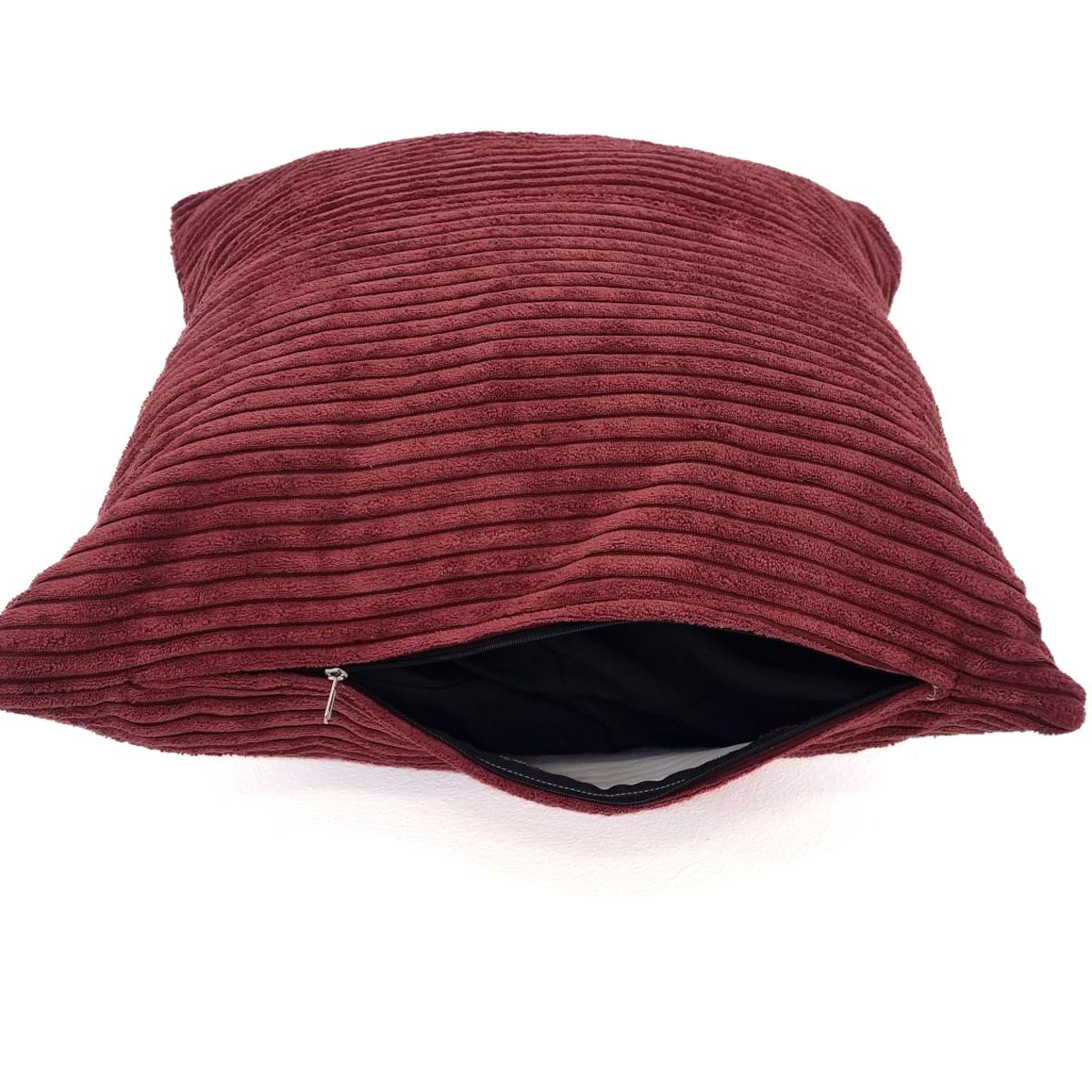 Maroon textured pillow with zipper on a white background