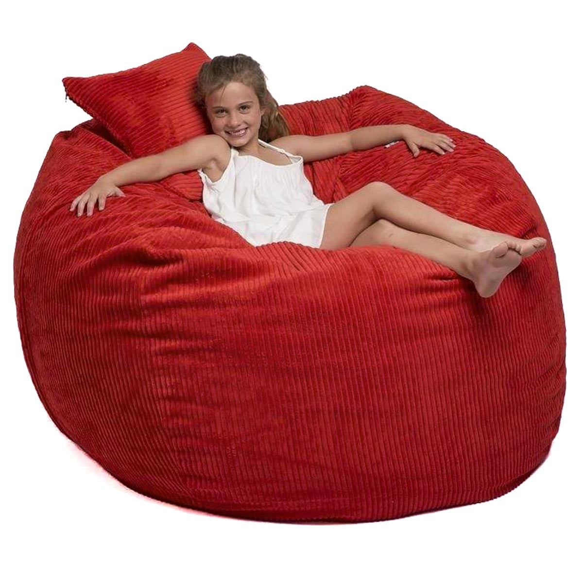 A child sitting comfortably inside a large red corduroy bean bag chair.