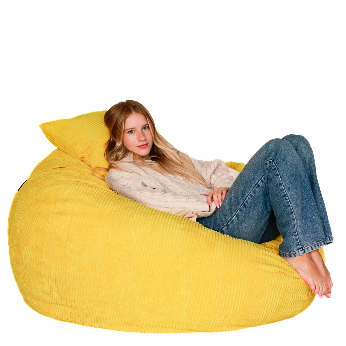 A person sitting on a yellow corduroy bean bag chair.