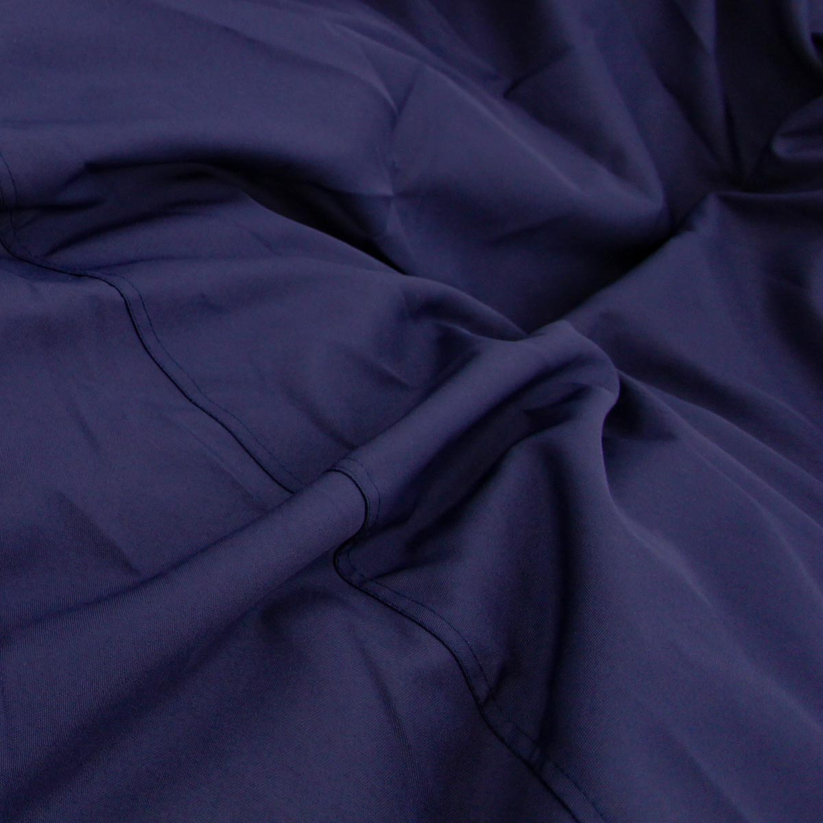 Close-up of dark blue fabric with folds
