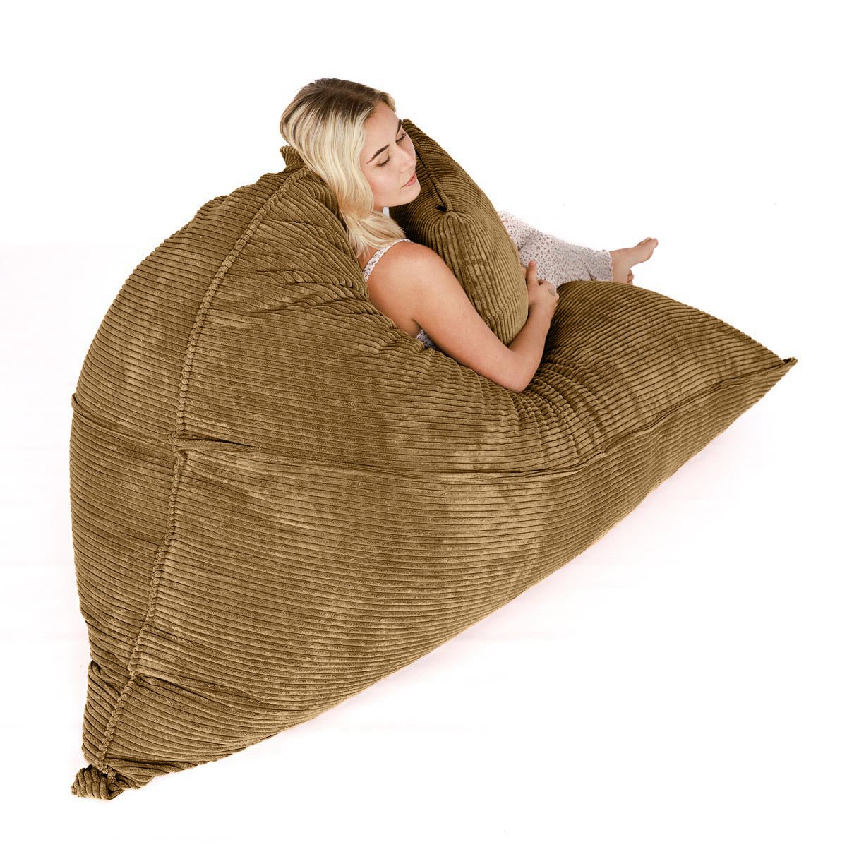 Woman sitting on light brown corduroy FlipSak beanbag