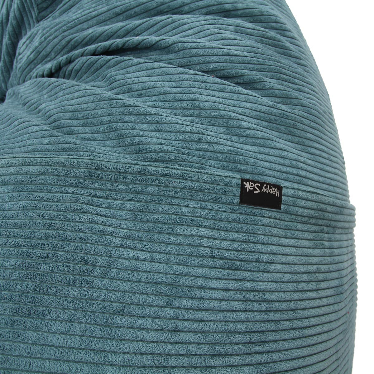 Close-up of a textured blue fabric with a brand label on a white background