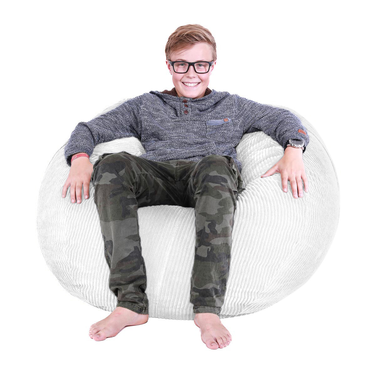 Person sitting on a white bean bag chair wearing a gray hoodie and camouflage pants.